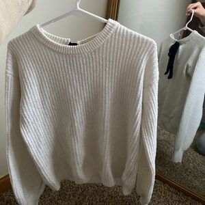 white sweater with black bow
